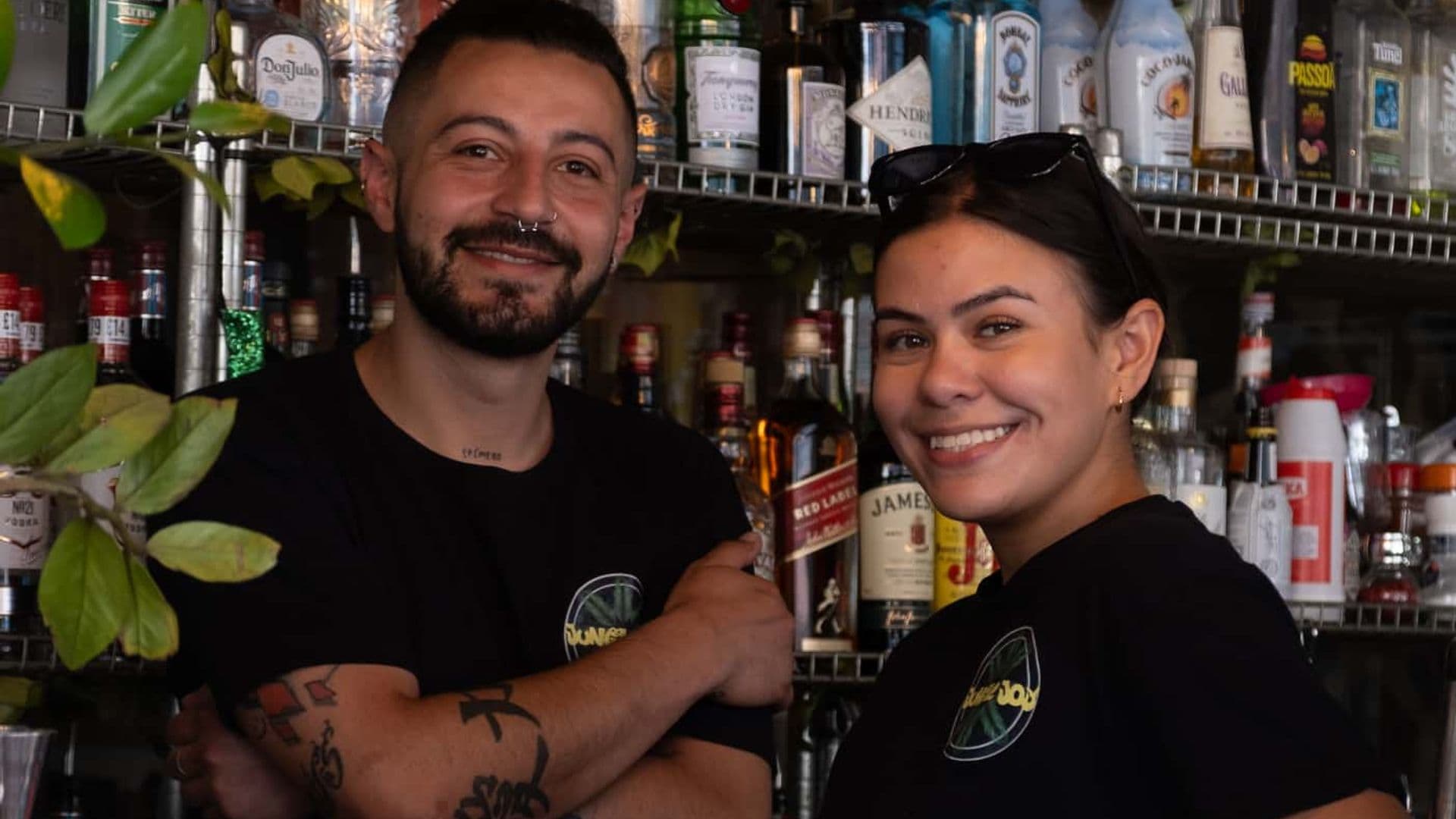 Jungle Joy bartender duo smiling behind the bar